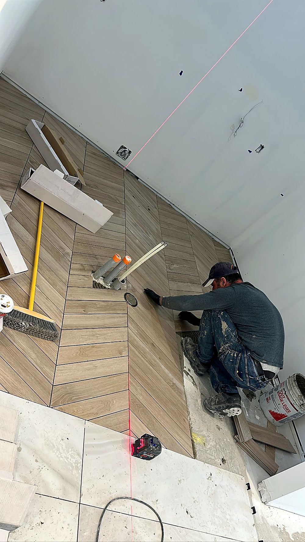 Automotive showroom with dark finished walls, slat wall detail and checkered floor